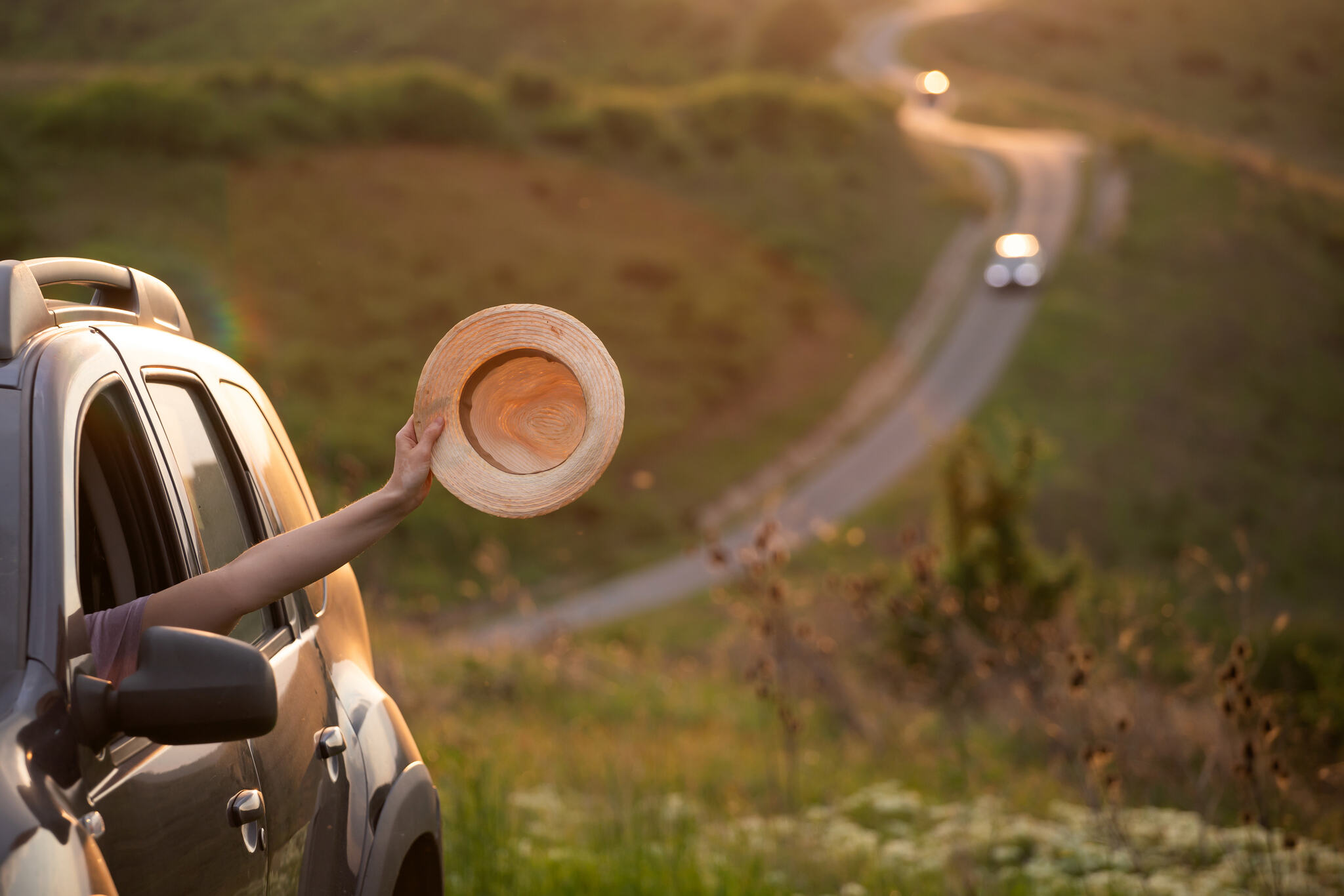 girl-with-hat-in-the-window-of-the-car-adventure-2024-06-11-17-20-32-utc_Easy-Resize.com