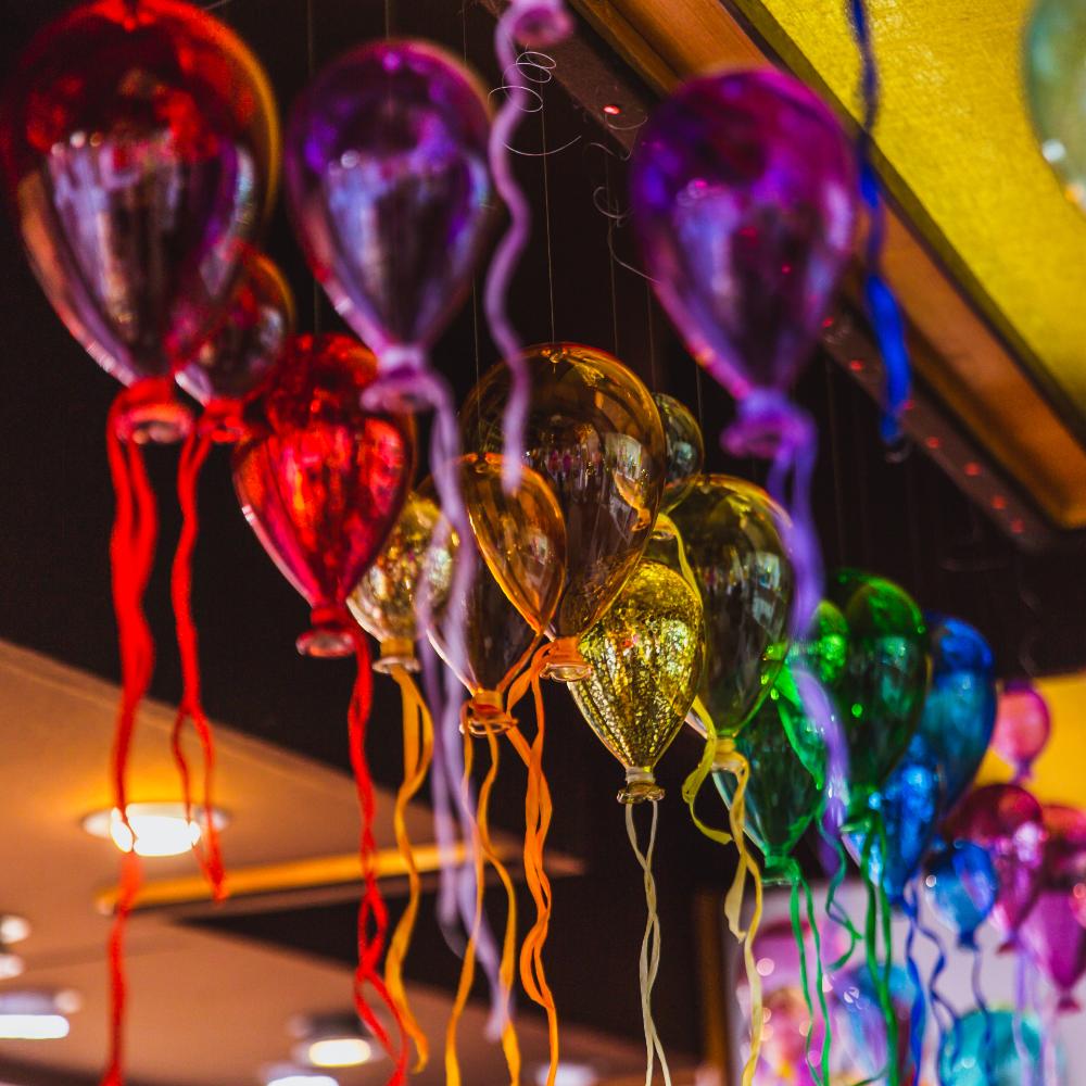 moulticoloured-group-of-glass-balloons-in-a-shop-o-2023-11-27-05-04-26-utc